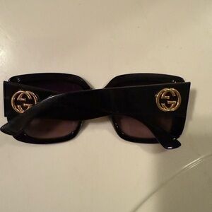 Gucci Sunglasses with Black Frame and Gold Logo